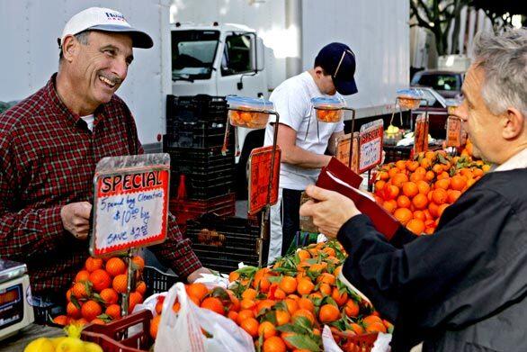 Fruit farmer Bob Polito, left, of Polito Family Farms, grows the less common, more flavorful items that place the Santa Monica Farmers Market among the three or four best in the nation. Although its main event is on Wednesday, Santa Monica also has farmers markets on Friday, Saturday and Sunday, making for an embarrassment of riches.