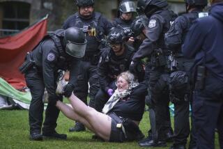 Police remove a protester on the University of Pennsylvania campus, in Philadelphia, on Friday, May 10, 2024. (Jessica Griffin/The Philadelphia Inquirer via AP)