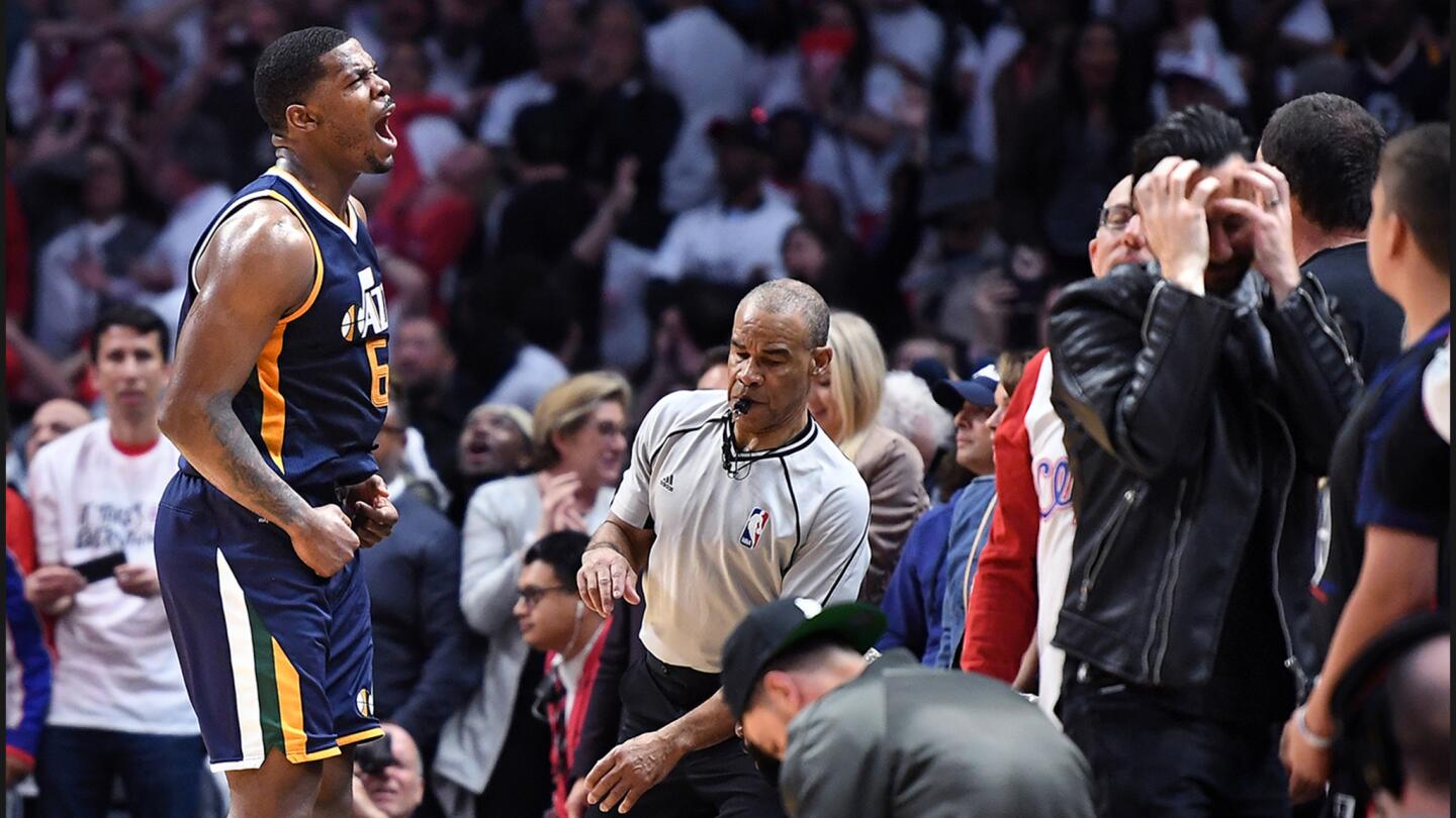 Jazz forward Joe Johnson celebrates his game-winning basket at the buzzer against the Clippers.