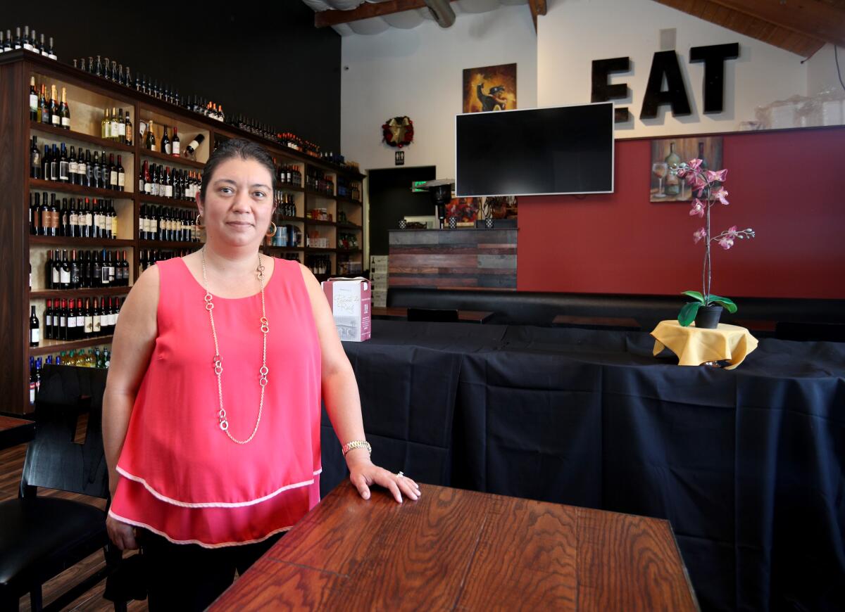 Cambalache Grill Argentine and Italian Cuisine owner Teresa Razo, who is president of the Fountain Valley Restaurant Assn., is shown at her restaurant in Fountain Valley on Saturday.