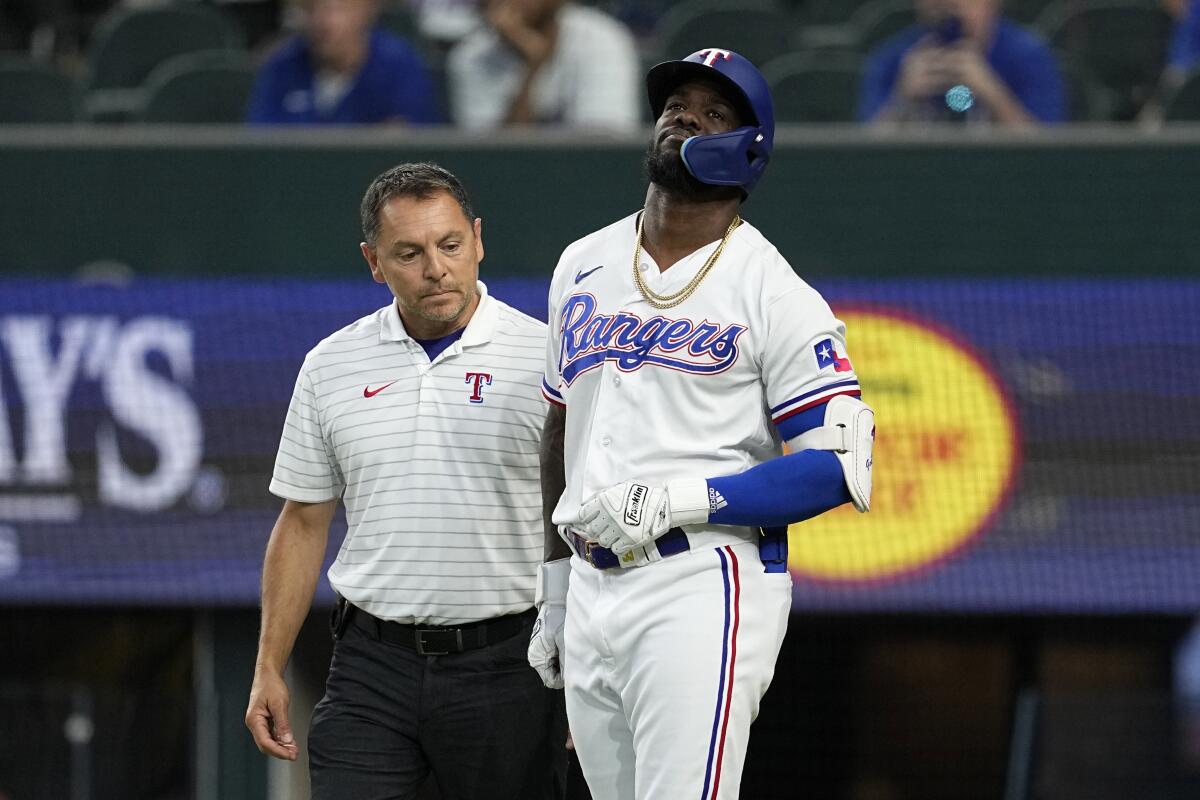 Rangers slugger Adolis García, leading the AL in RBIs, exits game after  getting hit by a pitch - The San Diego Union-Tribune