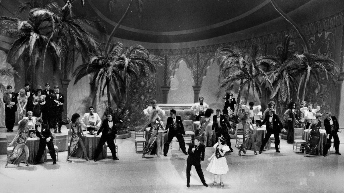 Actor Rob Lowe, left, with Snow White, played by Eileen Bowman, perform in a Cocoanut Grove-style nightclub setting in the much-maligned opening of the 1989 Oscars ceremony.