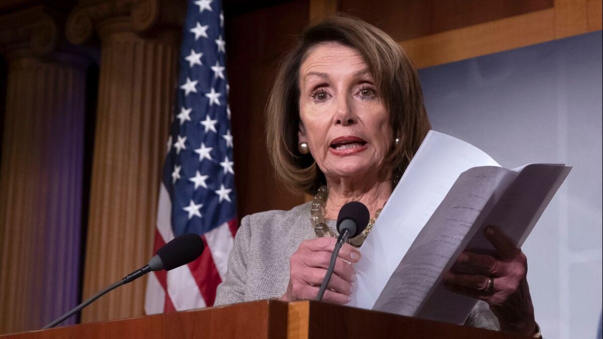 Democratic House Speaker Nancy Pelosi holds what she said is a continuing resolution bill, after President Trump agreed to end the longest partial government shutdown.