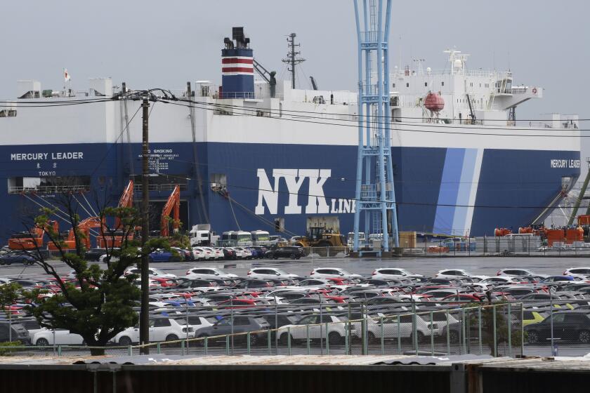 FILE - Cars for export park at a port in Yokohama, near Tokyo, on July 6, 2020.Japan’s exports grew nearly 12% in January as shipments jumped in vehicles, auto parts and machinery, according to government data Wednesday, Feb. 21, 2024. (AP Photo/Koji Sasahara, File)