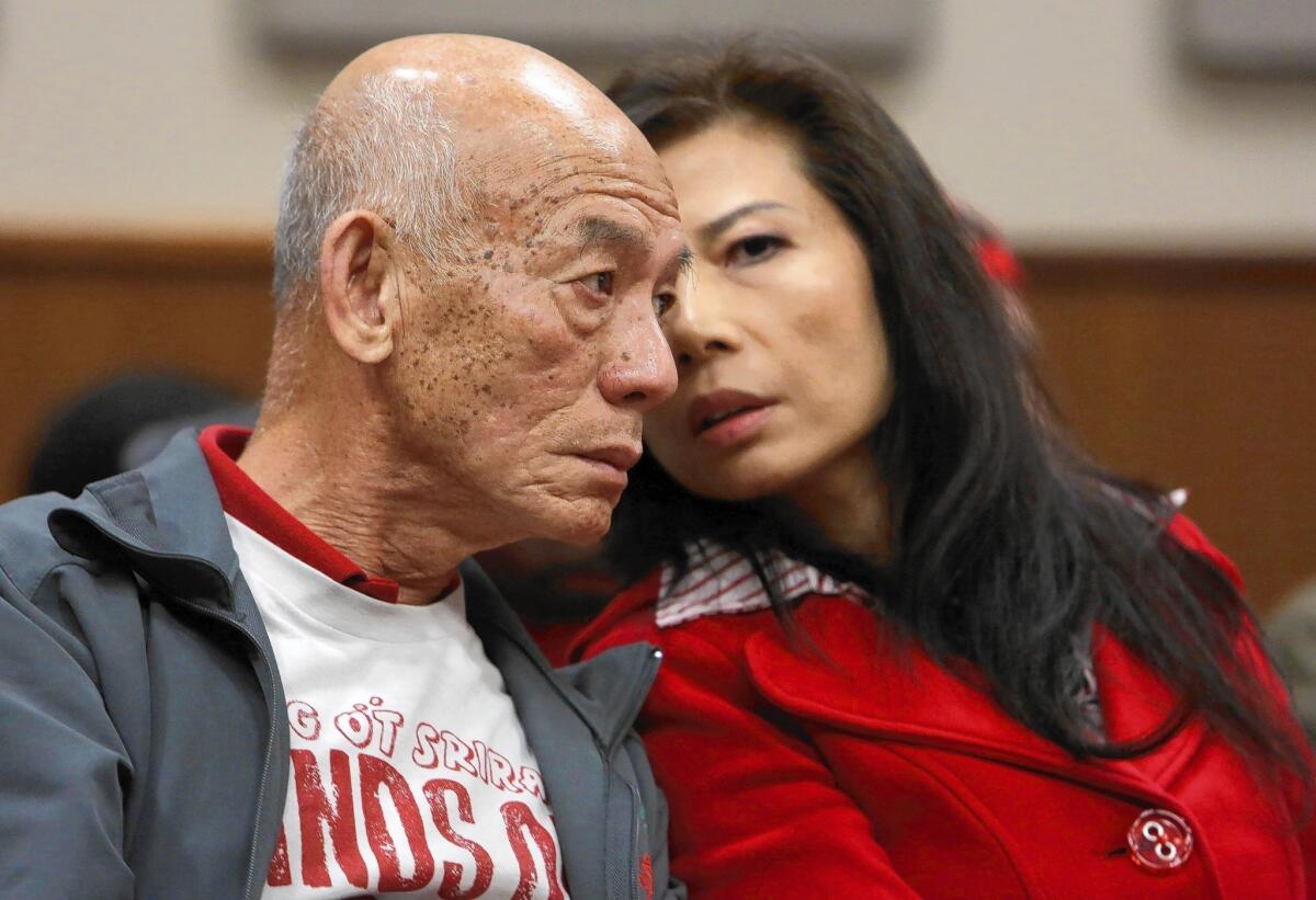 David Tran, founder of Huy Fong Foods Inc., left, and Donna Lam, Huy Fong Foods executive operations officer, confer during a hearing at Irwindale City Hall in February.