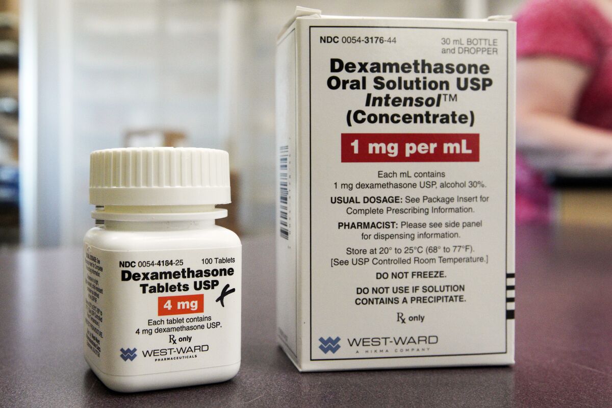 FILE - This Tuesday, June 16, 2020 file photo shows a bottle and box for dexamethasone in a pharmacy in Omaha, Neb. On Friday, July 17, 2020, British researchers published a report on the only drug shown to improve survival -- the inexpensive steroid dexamethasone. Two other studies found that the malaria drug hydroxychloroquine does not help people with only mild coronavirus symptoms. (AP Photo/Nati Harnik)