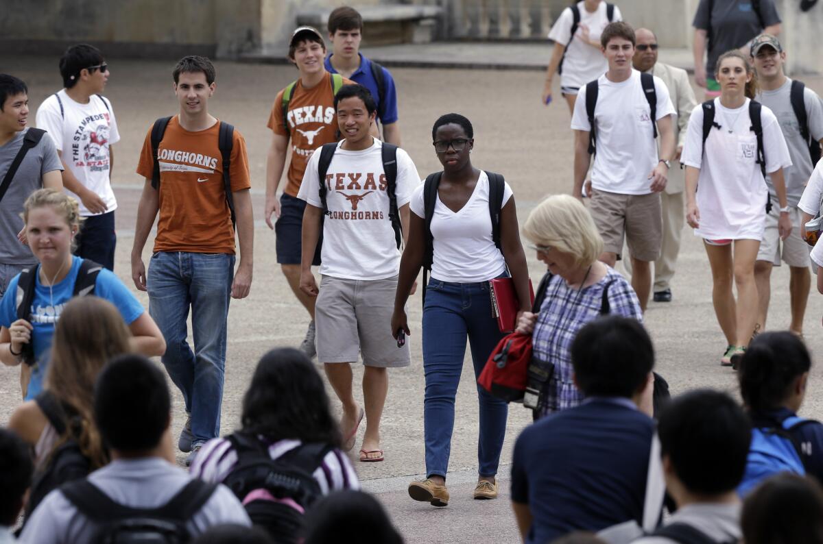Students walk through the University of Texas at Austin campus in Austin, Texas in 2012.