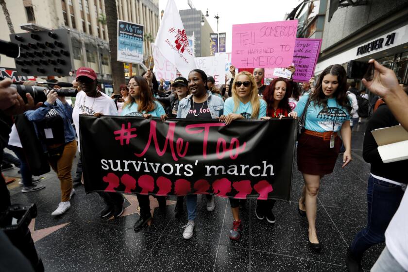 Sexual assault survivors and supporters rally down Hollywood Boulevard for the #MeToo Survivors' March against sexual abuse.