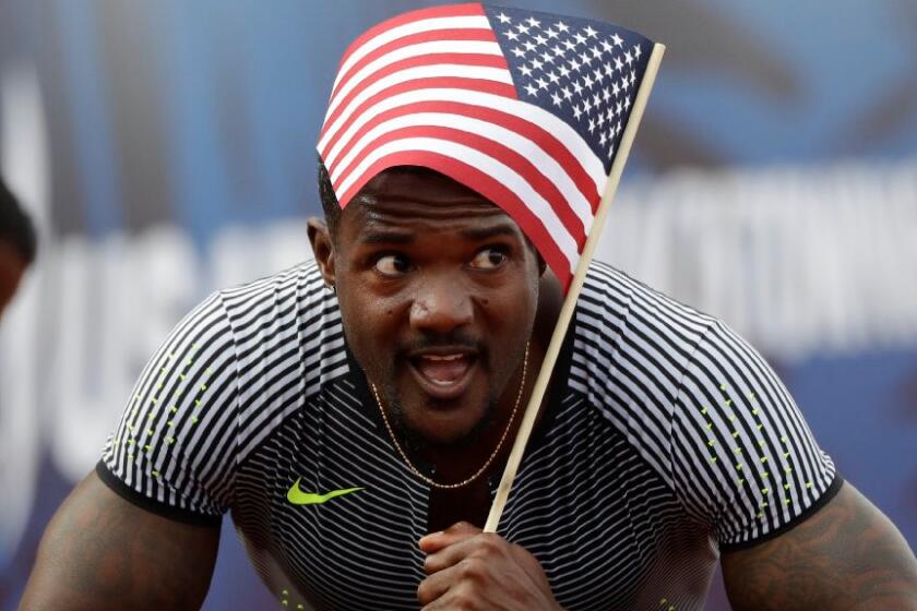 Justin Gatlin celebrates after winning the men's 200-meter run at the U.S. Olympic Track and Field Trials on July 9.