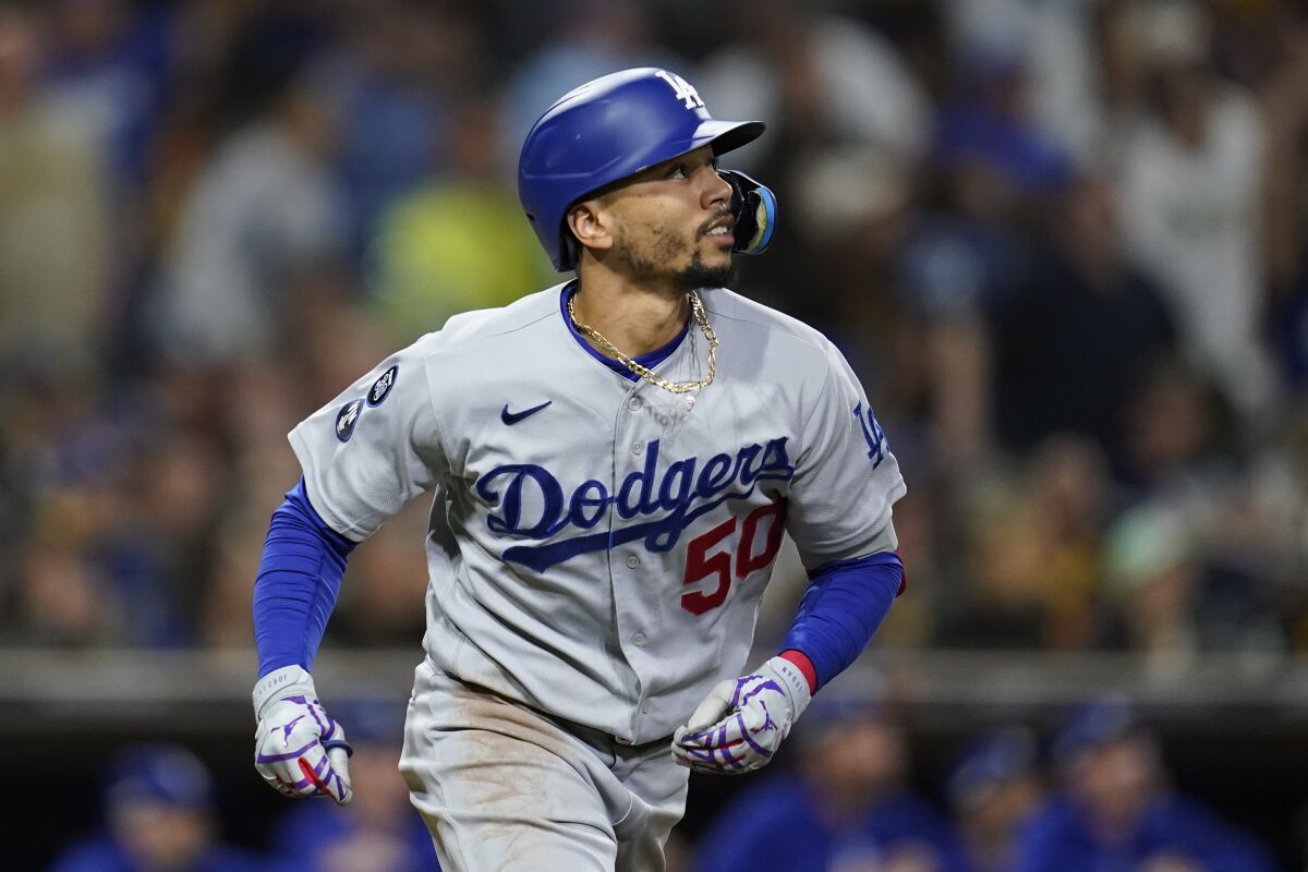 Dodgers right fielder Mookie Betts watches his fly out during the fifth inning of Game 4 in the 2022 playoffs.