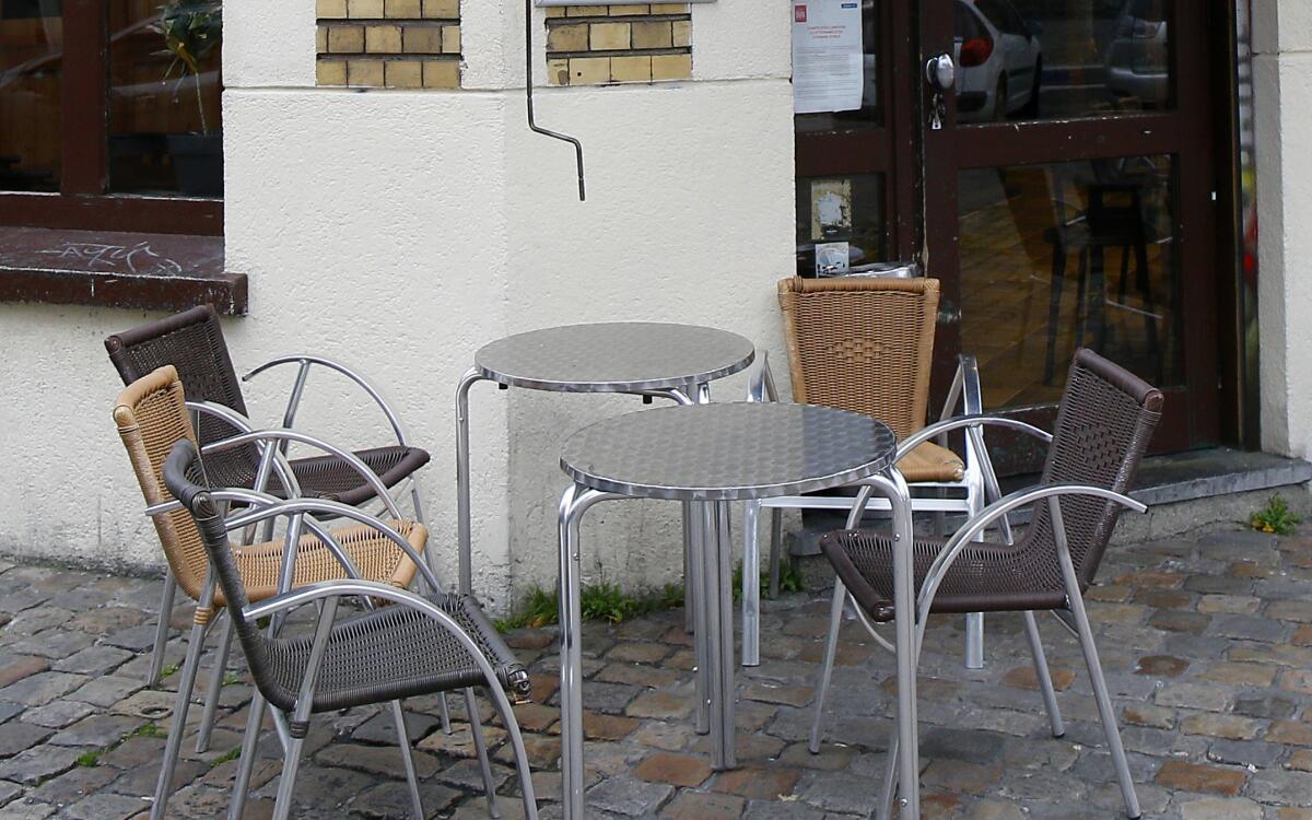 Empty cafe tables in Lille, France