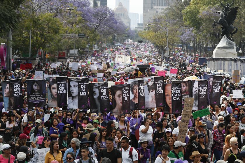 Women march during International Women's Day in Mexico City, Sunday, March 8, 2020. Protests against gender violence in Mexico have intensified in recent years amid an increase in killings of women and girls. (AP Photo/Eduardo Verdugo)