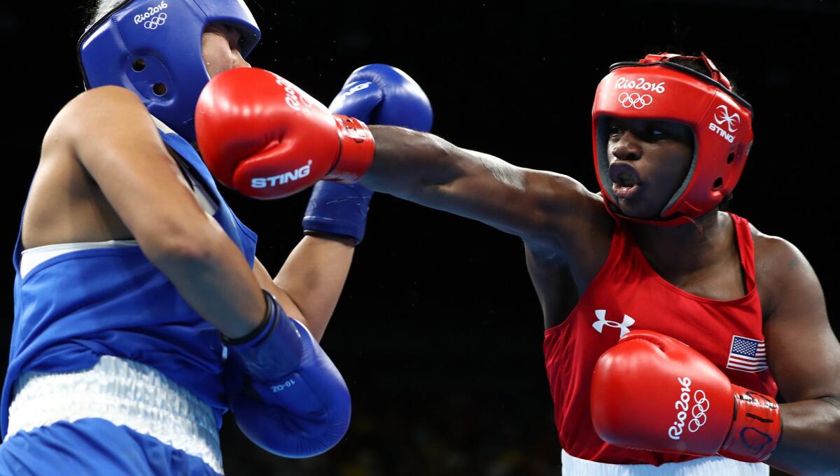American boxer Claressa Shields connects with an overhand right during her bout against Dariga Shakimova of Kazakhstan on Friday.