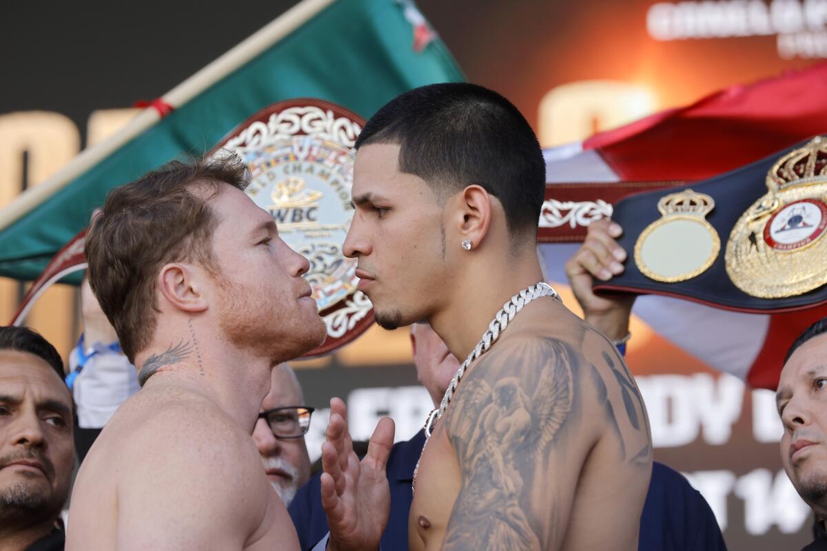  WBC/WBA/WBO super middleweight champion Canelo Álvarez and challenger Edgar Berlanga face off during a weigh-in