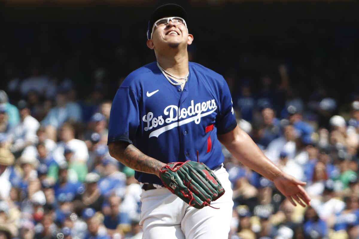 Julio Urias smiles from the mound