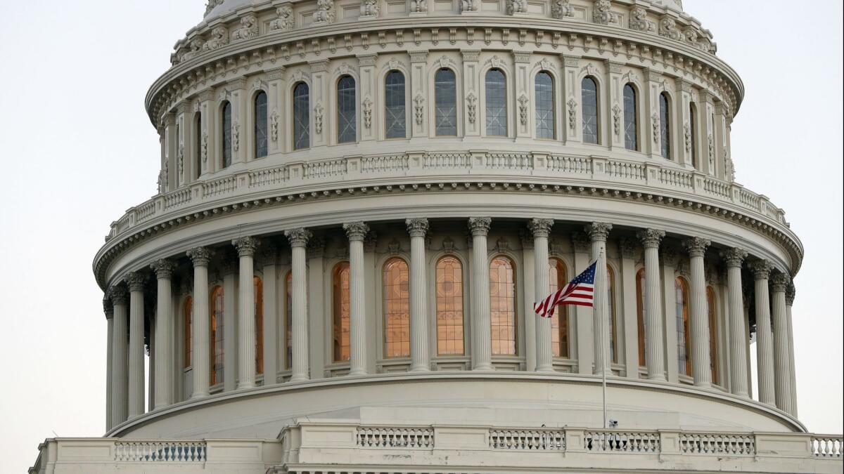 The American flag flies in front of the U.S. Capitol dome in Washington on Nov. 18, 2016.