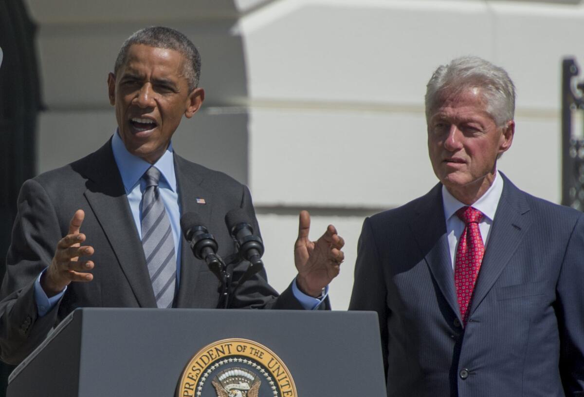 President Obama and former President Clinton take part in the AmeriCorps 20th-anniversary event on the South Lawn of the White House on Sept 12.