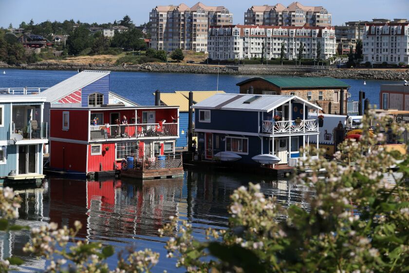 Picturesque Victoria, Canada, gets an added splash of color from the houseboats at its shore.
