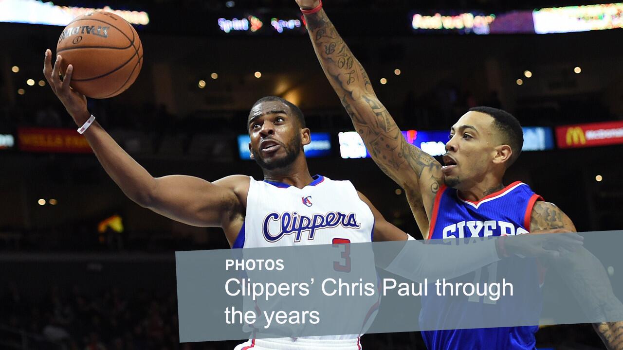 Chris Paul, left, puts up a shot in front of Philadelphia 76ers forward Malcolm Thomas on Jan. 3, 2015. Paul, who was acquired by the Clippers in 2011, is considered one of the NBA's top point guards.