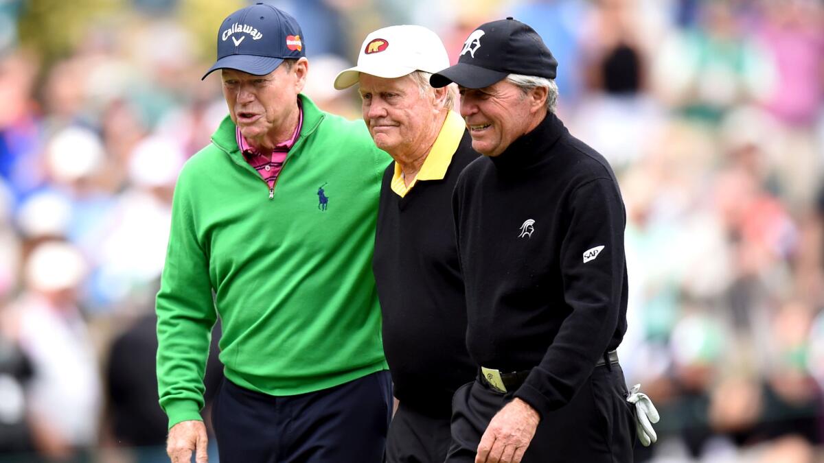 Legendary golfers (from left) Tom Watson, Jack Nicklaus and Gary Player walk together before the par-three contest at the Masters on Wednesday.