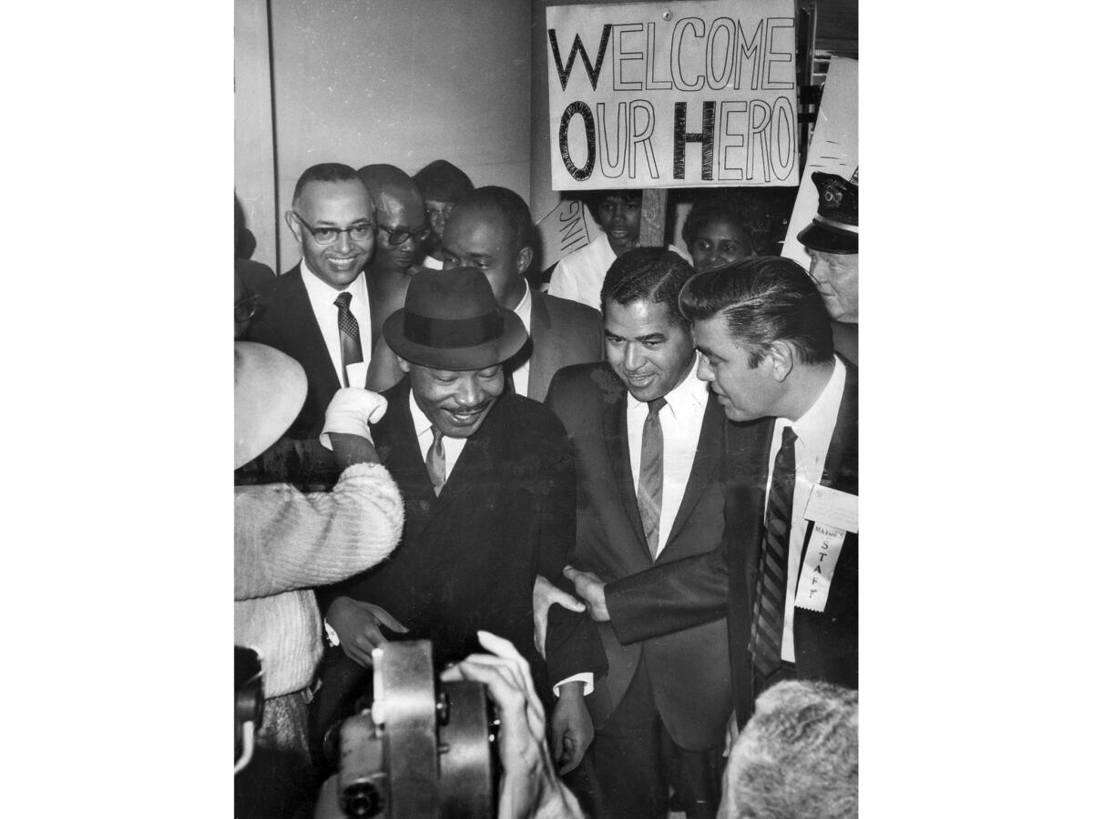 Feb. 24, 1965: A crowd of admirers welcomes King on his arrival at Los Angeles International Airport for a series of speeches.