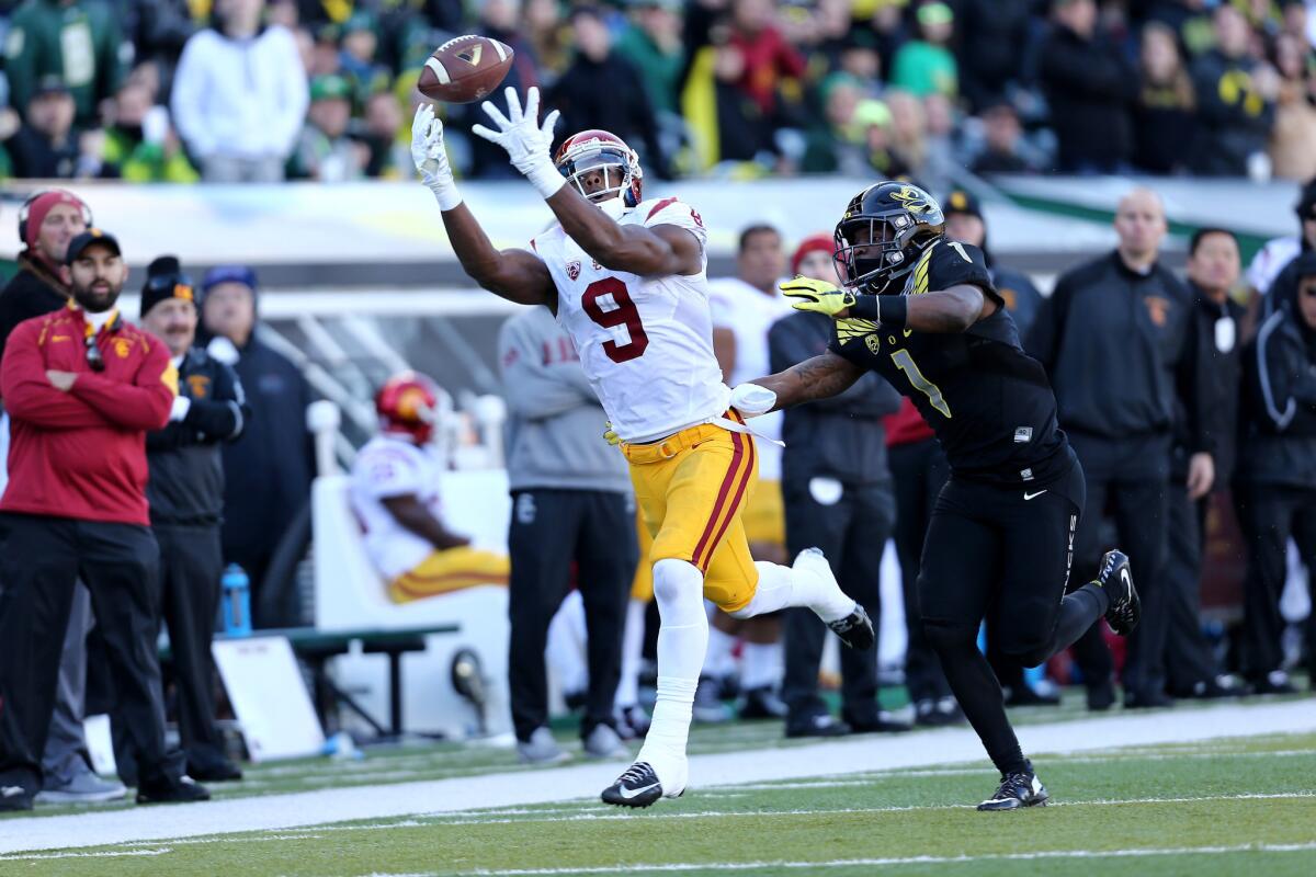 USC wide receiver JuJu Smith-Schuster (9) reaches for the football during the first half of a game against Oregon.