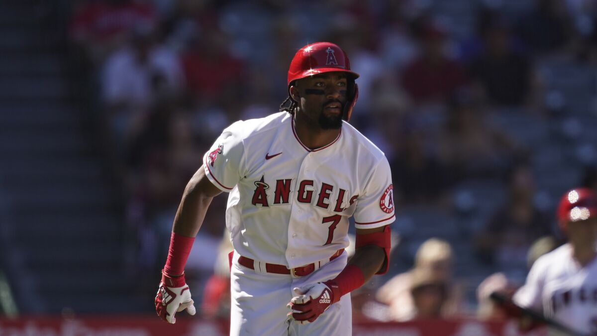 Angels' Jo Adell runs to first base during a game against the Texas Rangers.