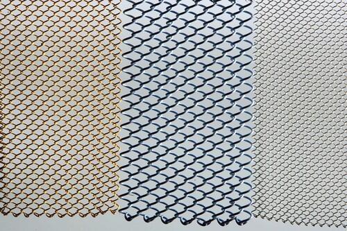 Maybe you've seen them hanging in the windows of Wolfgang Puck's steakhouse Cut in Beverly Hills or dividing the tables at one of Mandalay Bay's restaurants in Las Vegas. Now the metal drapery made by Cascade Coil is finding its way into homes, used not only as window sheers and privacy screens but also as modern room dividers and even shower curtains. The lightweight "fabrics," as the company calls them, come in dozens of sizes and finishes, including satin gold, bright nickel and copper.