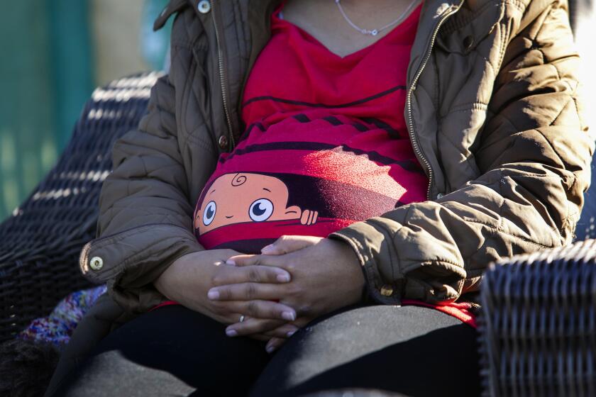 Estafany Ramirez, 23, who is fleeing violence in El Salvador, is eight months pregnant and was released in to the community by CBP to await her hearing. She is now sheltered at the Jewish Family Services shelter and was photographed on Thursday morning February 6, 2020.