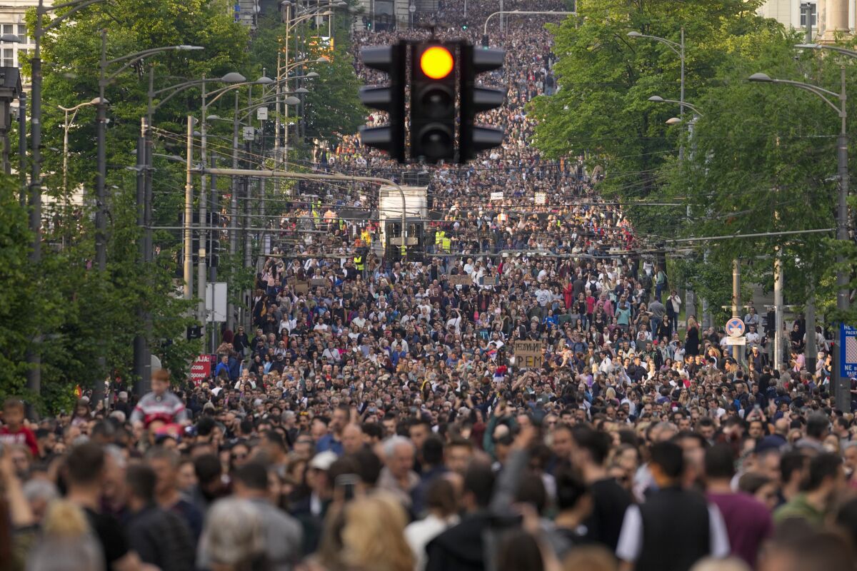 People march during a protest against violence in Belgrade, Serbia, Friday, May 19, 2023. Tens of thousands of people rallied in Serbia's capital on Friday for a third time in a month in protest at the government's handling of a crisis after two mass shootings in the Balkan country earlier this month, even as officials rejected the criticism and ignored their demands. (AP Photo/Darko Vojinovic)