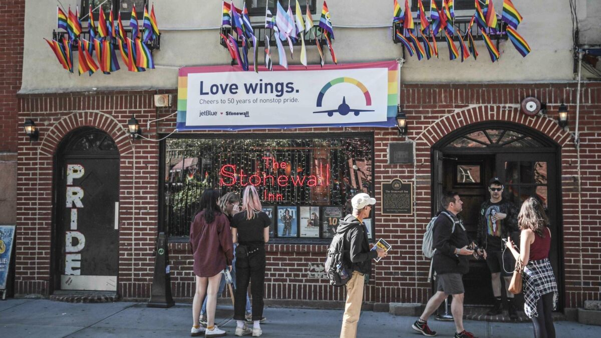 Pride flags adorn the Stonewall Inn bar in New York's Greenwich Village on June 3, marking the site of 1969 riots that followed a police raid of the bar's gay patrons.