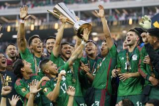 Mexico players celebrate with the winner's trophy after beating Panama 1-0 after the CONCACAF Gold Cup.