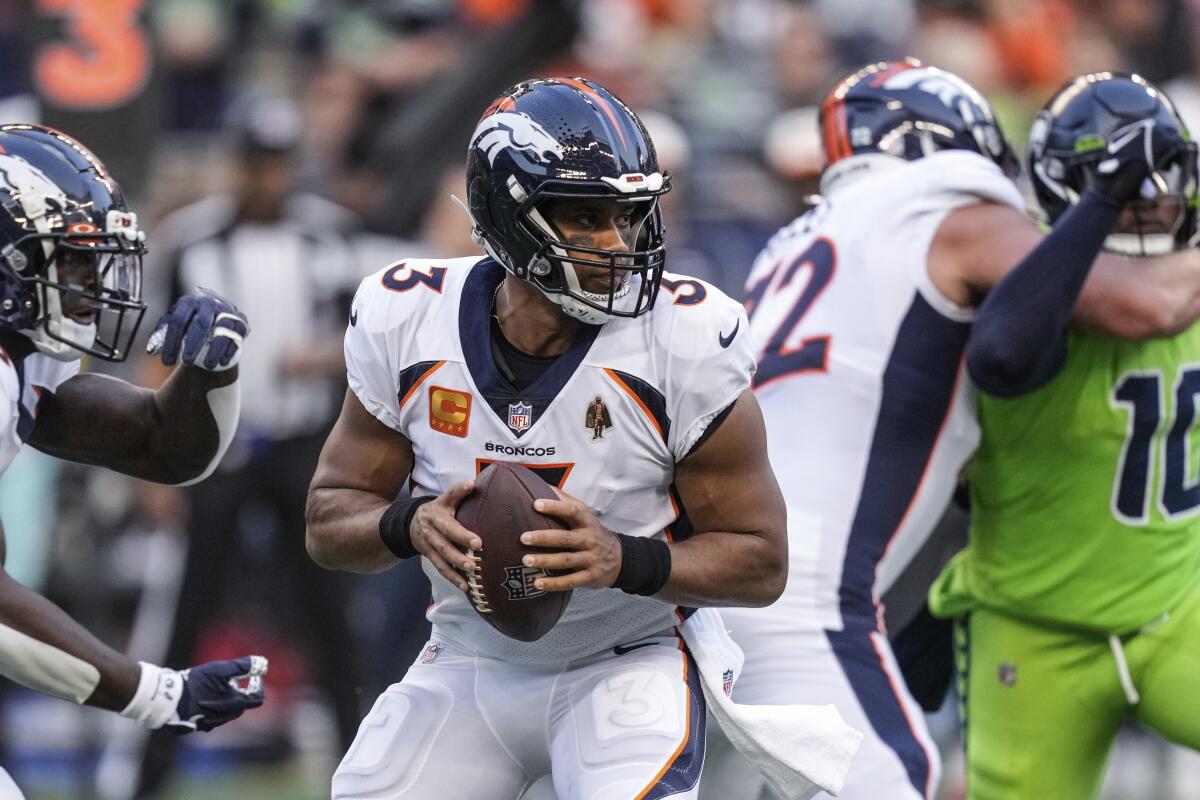 Denver Broncos quarterback Russell Wilson looks to pass.