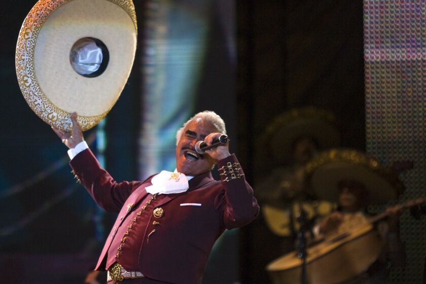 FILE - Vicente Fernandez performs at a free concert during Valentine's Day in Mexico City's on Feb. 14, 2009, file photo, singer. On Tuesday, Oct. 8, 2016. The Mexican singer died Sunday at 81 years of age in Guadalajara, Mexico, his family announced in a statement. (AP Photo/Claudio Cruz, File)