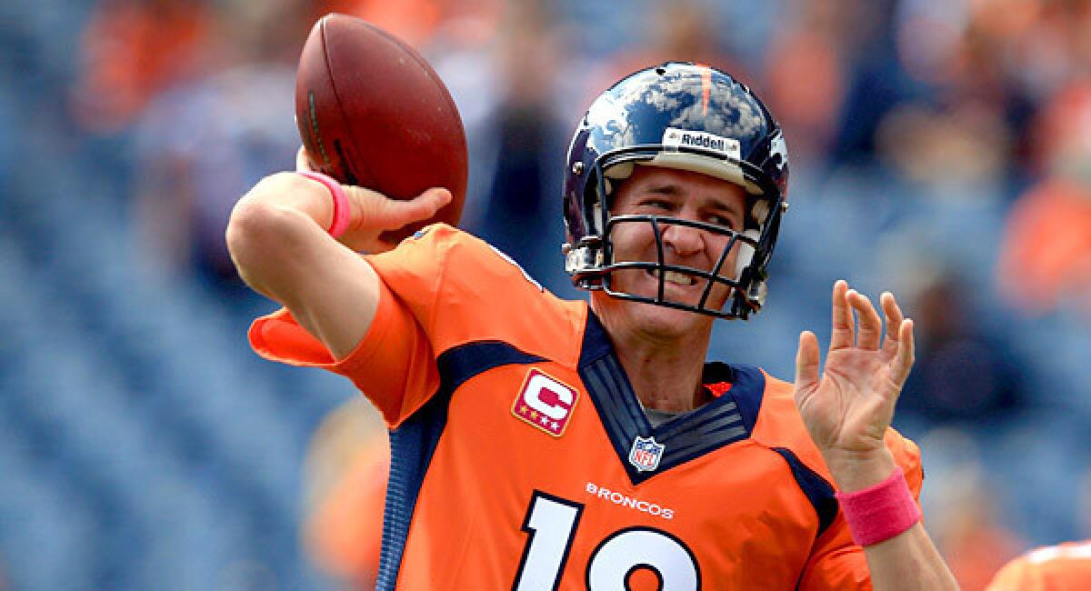 Quarterback Peyton Manning of the Denver Broncos warms up prior to facing the Jacksonville Jaguars.