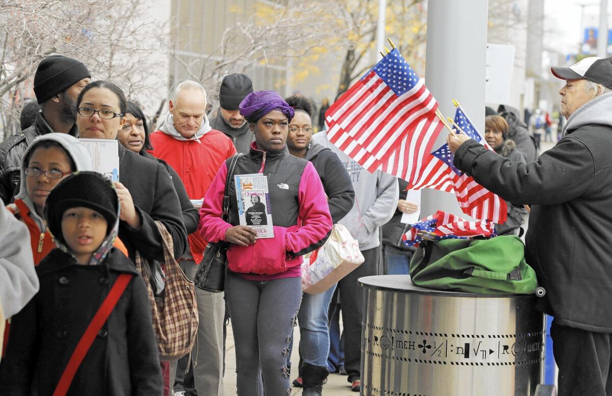 Voters wait outside the Cuyahoga County Board of Elections in Cleveland on the final day of early voting in 2012.