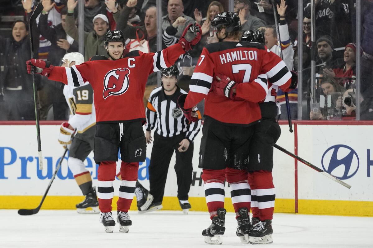 Hamilton scores 2 on power play, Devils win without Hughes