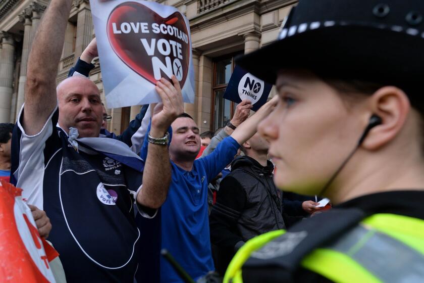 Pro-union demonstrators rally in Glasgow's George Square on the final day of campaigning in the Scottish referendum.