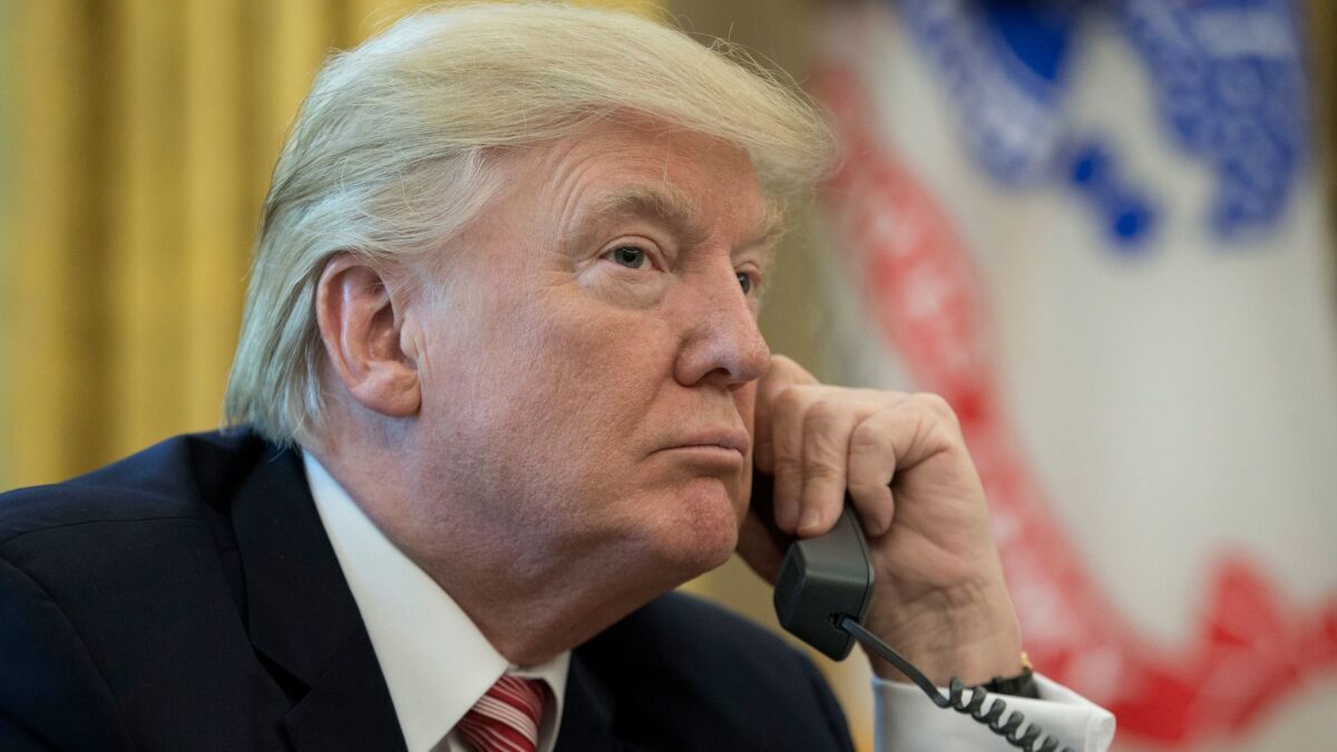 President Trump makes a phone call to Prime Minister of Ireland Leo Varadkar in the Oval Office on June 27, 2017.