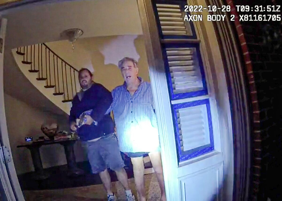 Body cam footage shows two men standing in the entryway of a home with upset expressions