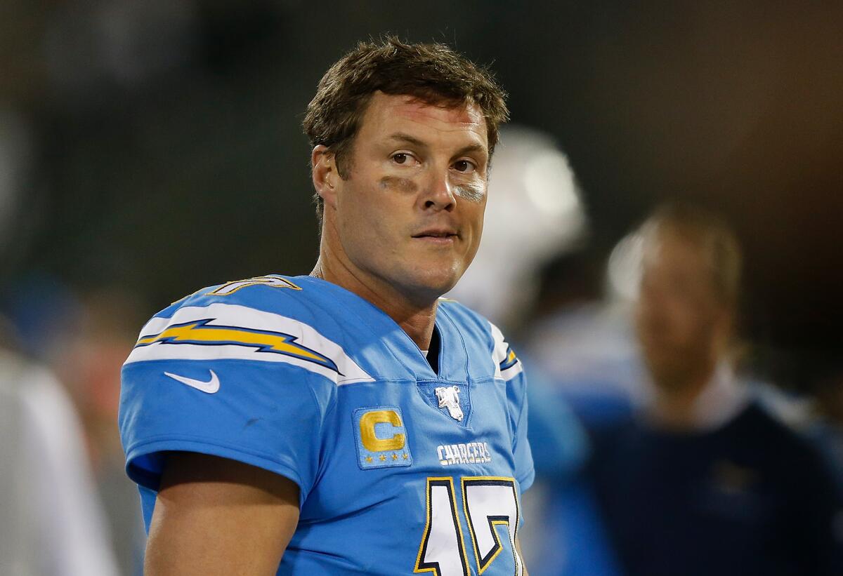 Chargers quarterback Philip Rivers watches from the sideline.