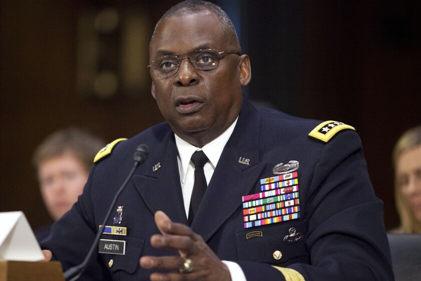 FILE - In this Sept. 16, 2015, photo, U.S. Central Command Commander Gen. Lloyd Austin III, testifies on Capitol Hill in Washington. Biden will nominate retired four-star Army general Lloyd J. Austin to be secretary of defense. That's according to three people familiar with the decision who spoke on condition of anonymity because the selection hadn't been formally announced. (AP Photo/Pablo Martinez Monsivais, File)