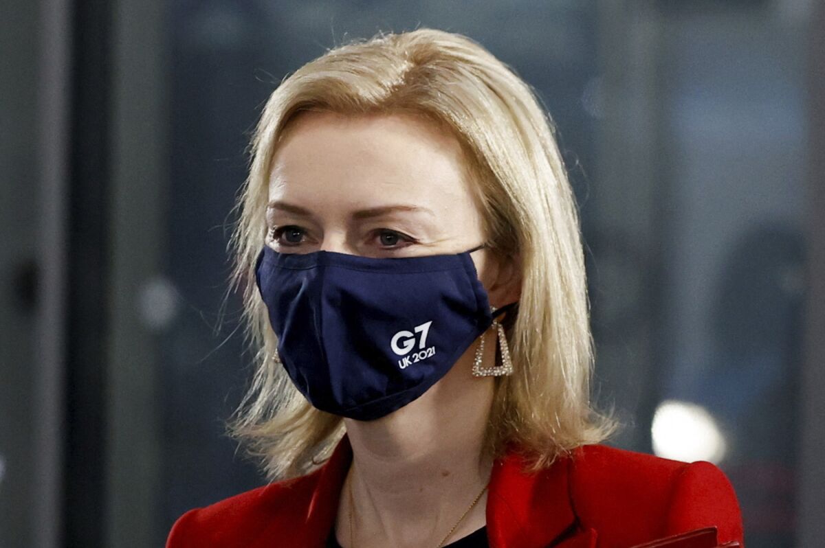 British Foreign Secretary Liz Truss in a face mask with G7 UK 2021 on it.