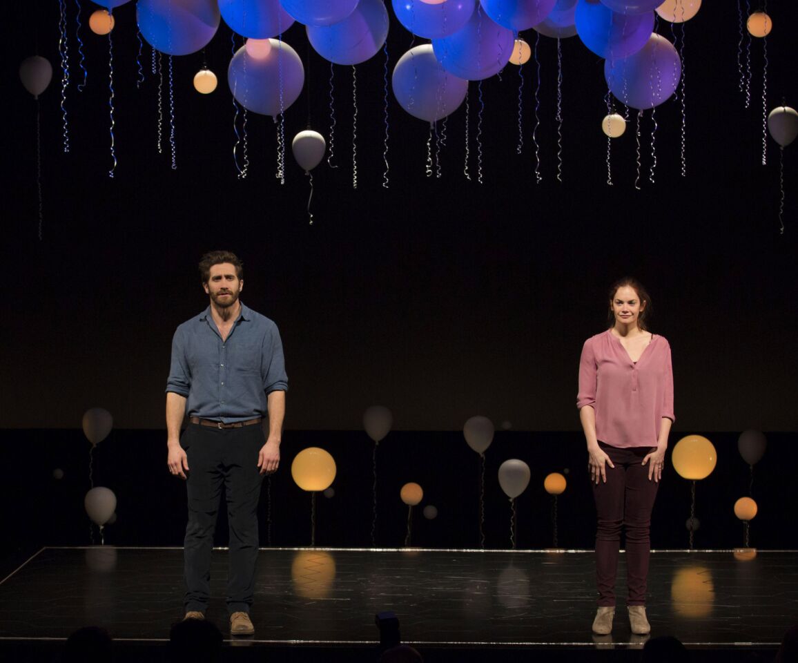 "Nightcrawler" actor Jake Gyllenhaal, left, and Ruth Wilson stand onstage at the opening night curtain call of "Constellations" at the Samuel J. Friedman Theatre.