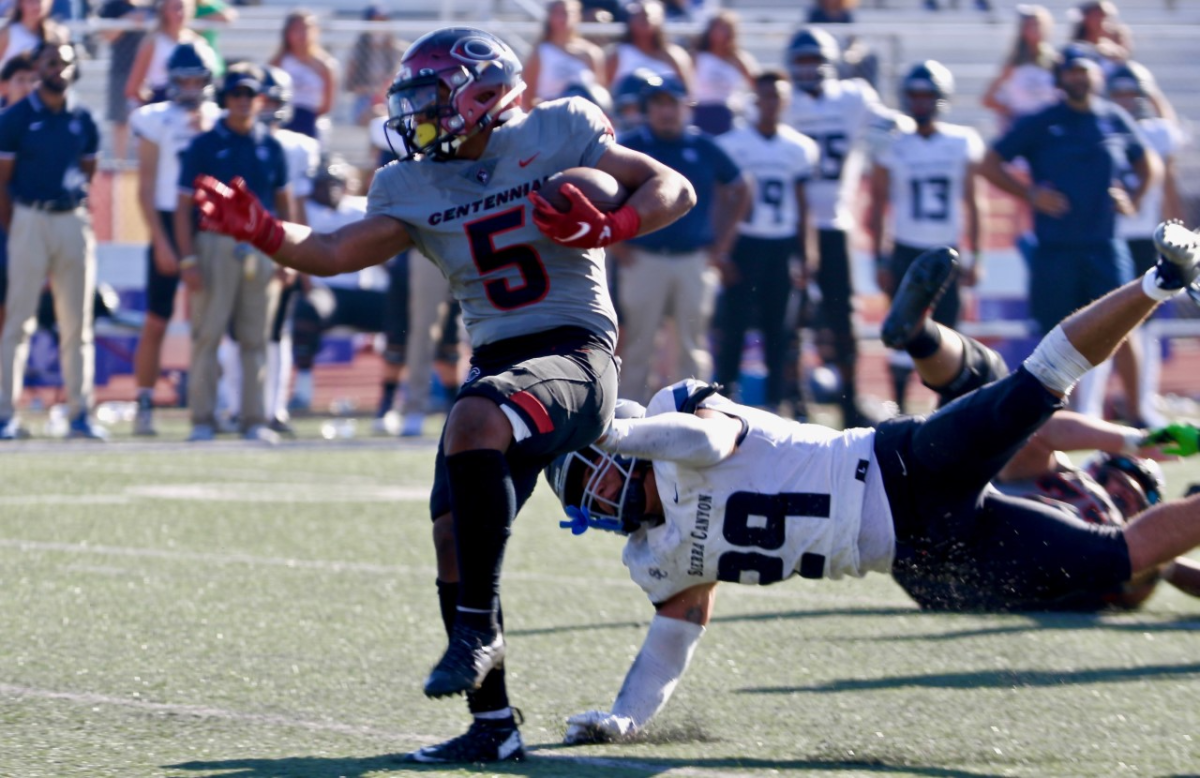 Centennial tailback Jayson Cortes sheds a tackle by Sierra Canyon linebacker Angelo Pulido in the first half.