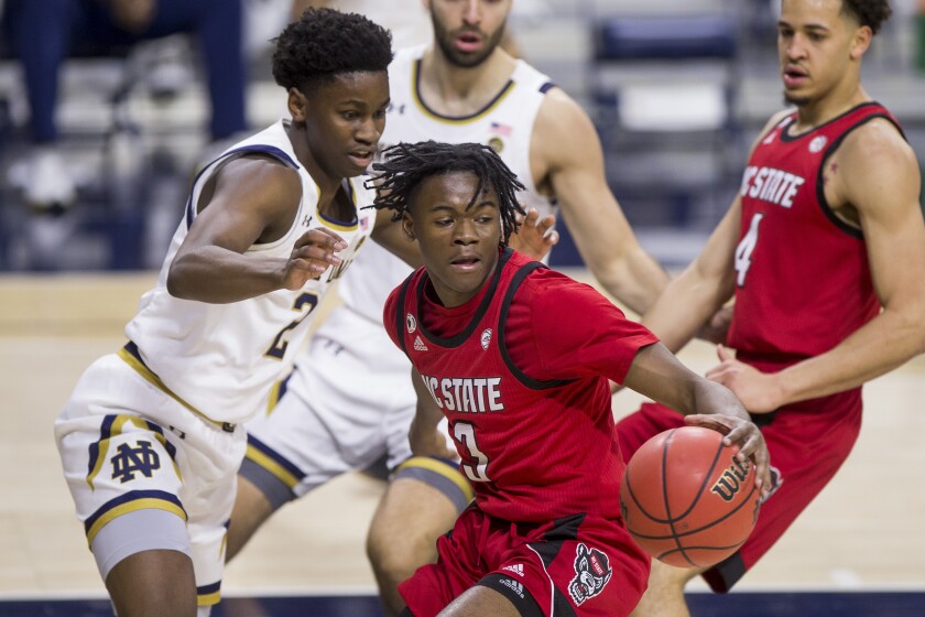 North Carolina State's Cam Hayes (3) gets pressure from Notre Dame's Trey Wertz (2) during the first half of an NCAA college basketball game Wednesday, March 3, 2021, in South Bend, Ind. (AP Photo/Robert Franklin)