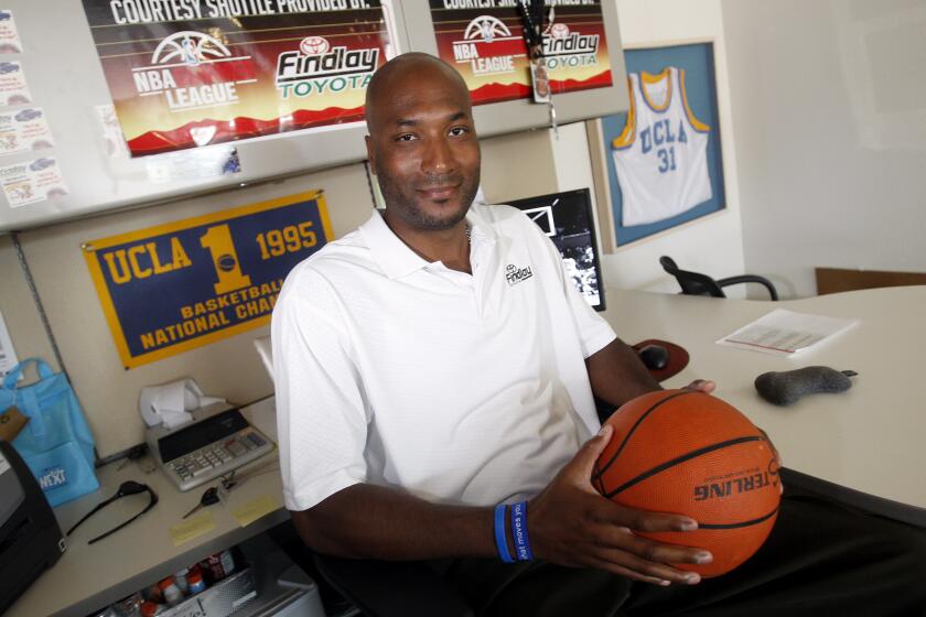 In this Sept. 18, 2010, file photo, former UCLA basketball player Ed O'Bannon Jr. sits in his office in Henderson, Nev. A federal appeals court agreed Wednesday, Sept. 30, 2015, that the NCAA's use of college athletes' names, images and likenesses in video games and TV broadcasts violated antitrust laws but struck down a plan to allow schools to pay players up to $5,000. The decision came in a lawsuit filed by O'Bannon and 19 others. (AP Photo/Isaac Brekken, File)