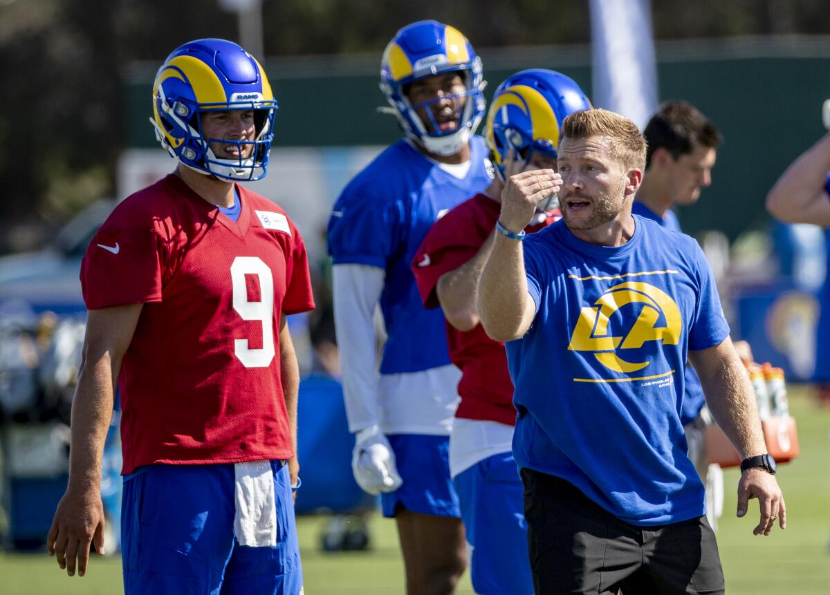 Rams coach Sean McVay instructs players in front of starting quarterback Matthew Stafford.