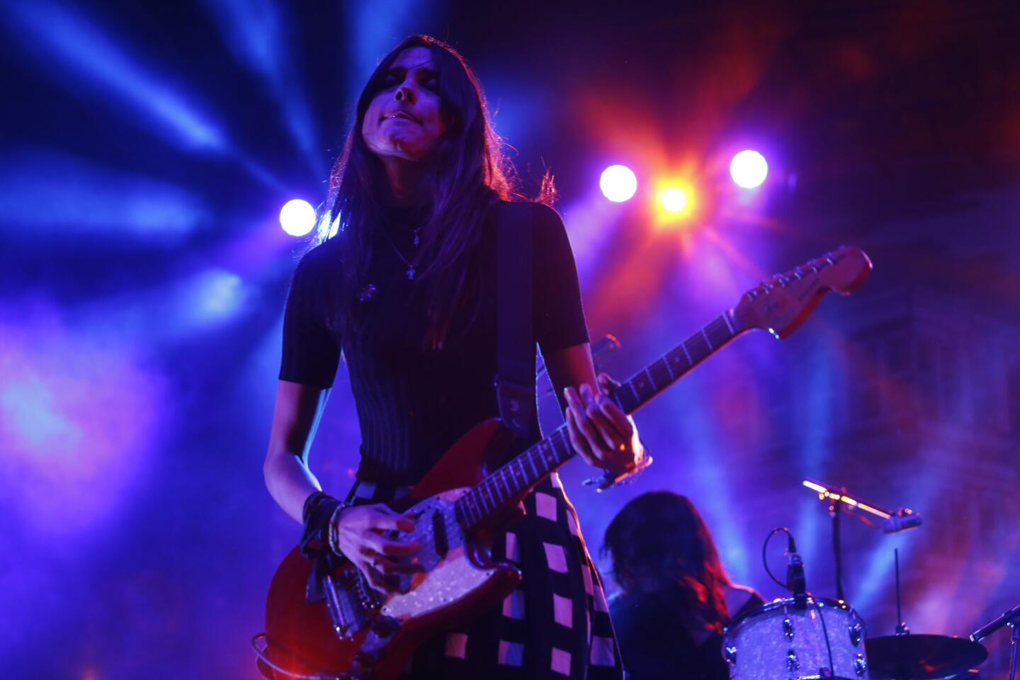 Theresa Wayman, on guitar, performs with the band Warpaint at the Music Tastes Good festival in Long Beach on Sept. 24.