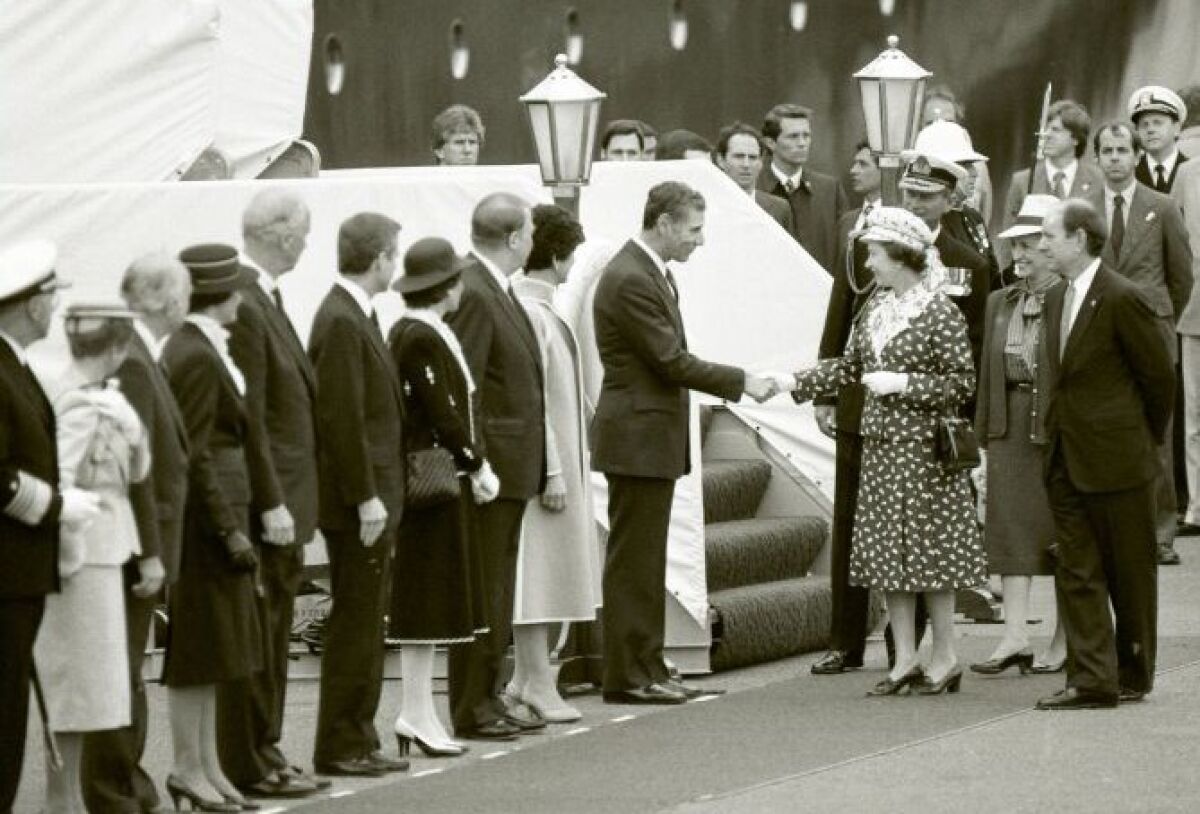 Queen Elizabeth greets Gov. George Deukmejian upon her arrival in San Diego in 1983. 